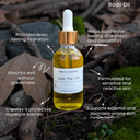 Body oil bottle with dropper labeled 'Beat The Chill' on a natural background