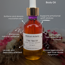 Fae Nectar body oil bottle with dropper on a wooden surface, surrounded by dried flowers.