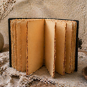 Vintage-style leather-bound notebook on a textured surface with decorative elements.